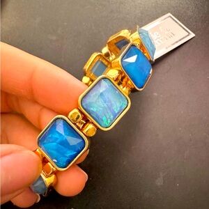 Gold tone, blue multi square stone stretch bracelet